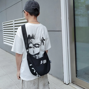 Kids black half-moon crossbody bag with white letters and wide canvas shoulder strap
