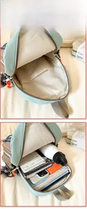 Internal compartments of kids backpack showing large capacity for books and bottles