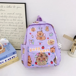 Macro shot of purple checkered backpack with cute Capybara prints and side pockets