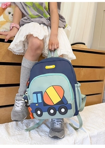 Detail of a large capacity kids backpack featuring a 3D cement mixer truck design