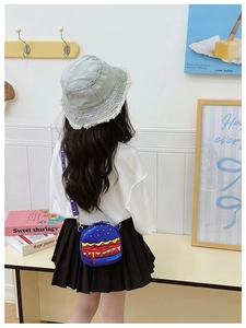 Close-up of cute burger-shaped kids shoulder bag with adjustable striped strap