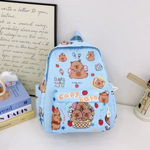 Detail shot of light blue checkered backpack with Capybara and strawberry prints