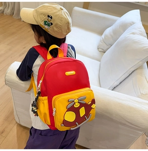 Detail of red and yellow cartoon helicopter backpack with ergonomic wide shoulder straps
