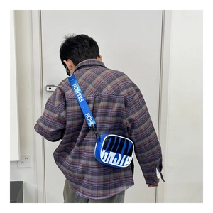 Detail of blue and black color-block kids crossbody bag with FASHION strap design