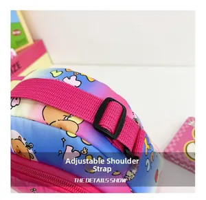 Detail of adjustable pink woven shoulder strap on cartoon gradient crossbody bag