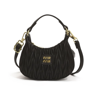 Elegant black Matelassé quilted half-moon handbag with gold hardware and top handle for girls