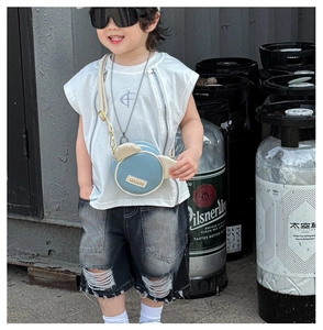 Street style kids outfit with a cute bear head crossbody bag and denim shorts