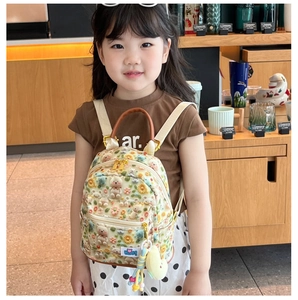 Detailed shot of kid canvas backpack with 3D bear embroidery and star charm accessory