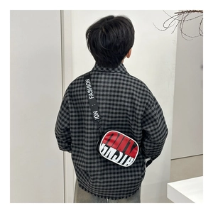 Rear view of a child wearing a color-block crossbody bag with wide 'FASHION' nylon strap