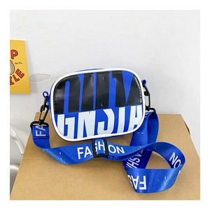 Detail of blue square crossbody bag with graffiti print and wide fashion strap