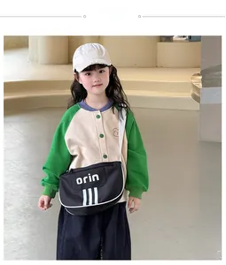 Modern kid's crossbody bag with stylish white stripes and lettering for outdoor wear
