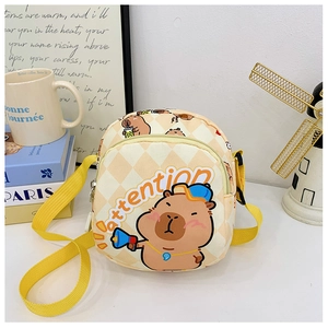Detail of cute Capybara cartoon messenger bag with yellow strap and quilted texture