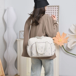 Stylish large capacity quilted mommy bag with silver polka dot print and shoulder strap