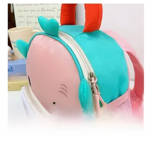Detail of smooth double zippers and side mesh pocket on pink cartoon kids backpack