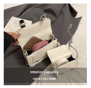 Vue détaillée de l'intérieur du sac bandoulière blanc montrant la capacité pour téléphone