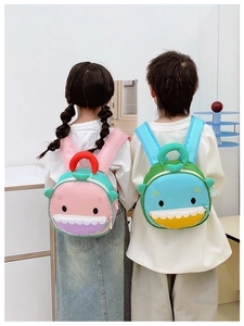 Rear view of children wearing cute cartoon shark backpacks with colorful 3D fin details