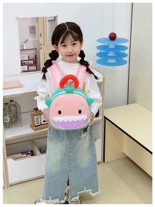 Detailed view of kids cartoon shark backpack featuring 3D teeth and lightweight fabric