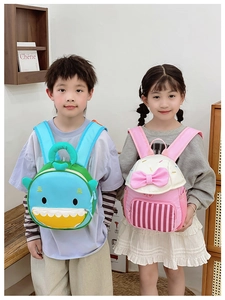Kids backpack showing 3D shark fins and sweet bow details on breathable straps