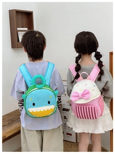 Detail showing toddler backpacks with shark and bow designs and mesh side pockets