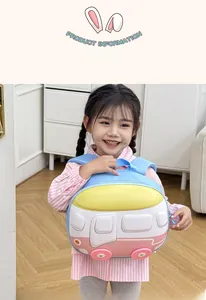 Detail view of a 3D cartoon bus backpack on a young girl in a cozy home setting