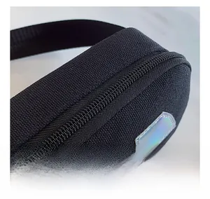 Macro shot of smooth black plastic zipper and durable fabric texture on kids crossbody bag