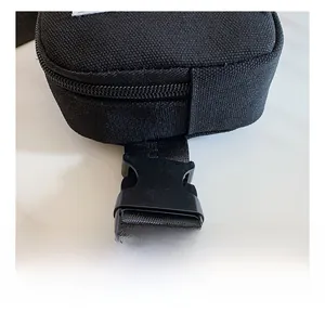Detail of durable plastic buckle and high-density black canvas strap on a kids' bag