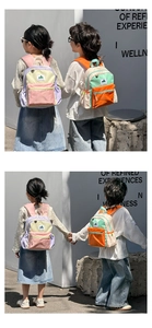 Detail view of colorful ergonomic straps and waterproof nylon fabric on children backpack