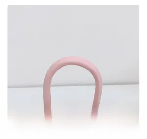 Detail of pink princess handbag with smooth handle and cute decorative bow design