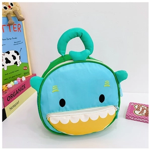 Detail of round cartoon shark lunch bag with blue embroidery and 3D fin design
