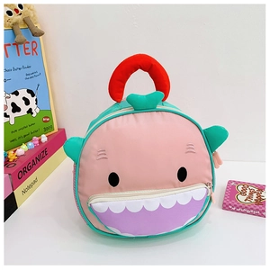 Detail view of pink shark-shaped kids backpack with waterproof nylon and zipper opening