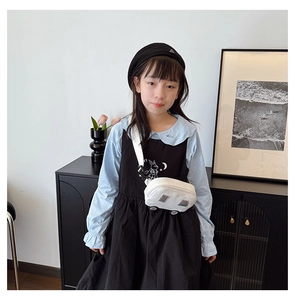 Detail of creative car-shaped crossbody bag and toddler fashion outfit with rabbit print