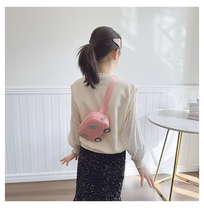 Close-up of pink car-shaped canvas chest bag with silver windows for toddlers