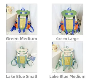 Detail view of stylish color-block canvas backpacks in green and blue for kids
