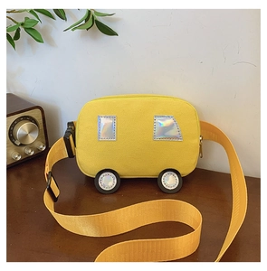 Detail of yellow car-shaped canvas bag with laser sequins and adjustable strap