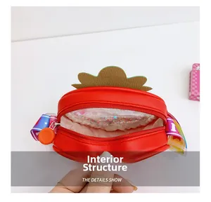 Detail showing the inner sequin compartment and rainbow strap of the strawberry bag