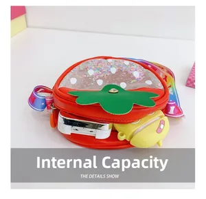Detail showing internal capacity of the strawberry crossbody bag with sequins