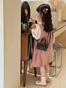 Fashionable mini pink girls handbag with sweet bow detail in a vintage lifestyle scene