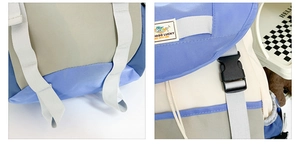 Detail view of the colorful kids backpack featuring a plastic buckle and woven shoulder strap
