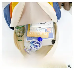 Detail view of large capacity school backpack interior showing books and tablet storage