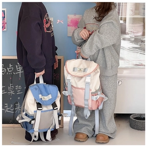Close-up of stylish color-block school backpacks with flap closure and dual buckles for kids