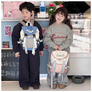 Detailed view of canvas backpacks in blue-grey and pink-white colors for kids
