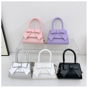 Detailed group view of colorful bow square bags with elegant metal chain shoulder straps