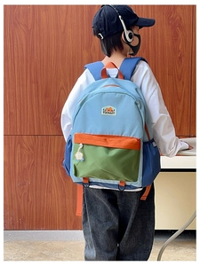 Detail view of colorful ergonomic shoulder straps on a durable school backpack