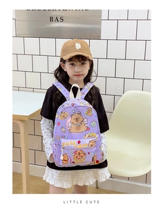 Detail of purple plaid schoolbag featuring cute cartoon Capybara prints and white handle
