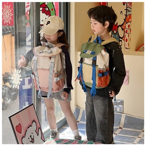 Kids outdoor style backpacks with flap buckles shown by two children on a street