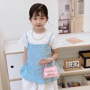 Cute pink mini handbag for girls featuring a decorative bow and gold metal chain strap
