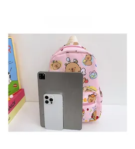 Pink checkered children backpack with bear prints compared to a tablet for size reference