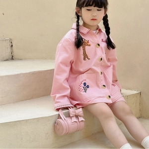 Pink cylinder handbag for girls with a large bow and sweet minimalist design