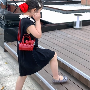 Cute red cylinder handbag for girls featuring a 3D bow and stylish crossbody strap