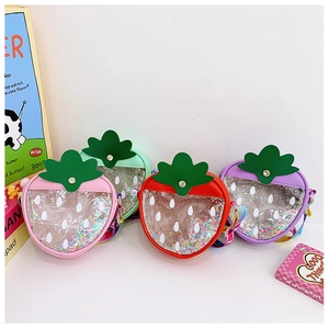 Detailed display of four colorful strawberry shaped kids bags with glitter sequins